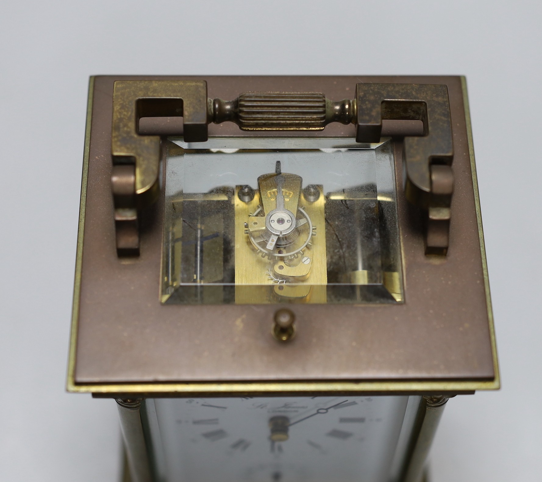 A large brass cased carriage clock retailed by St. James, 17cm